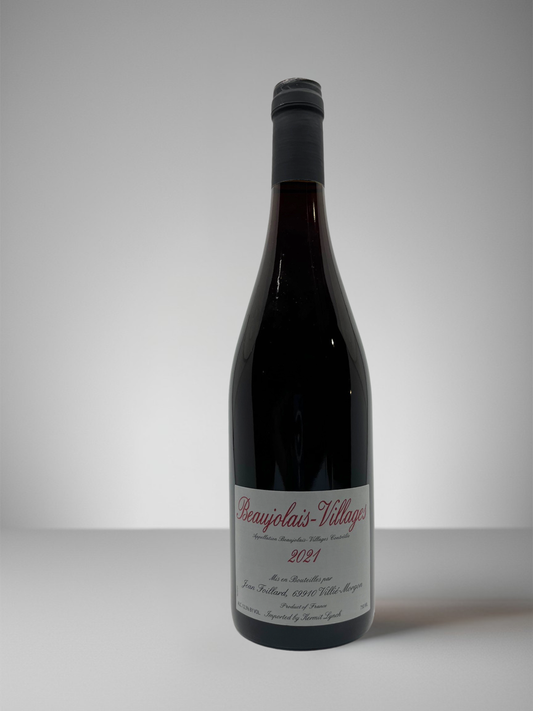 Bottle of Jean Foillard Beaujolais-Villages 2023, a light-bodied French red wine made from Gamay, showing a bright ruby color with fresh red berry and floral notes.